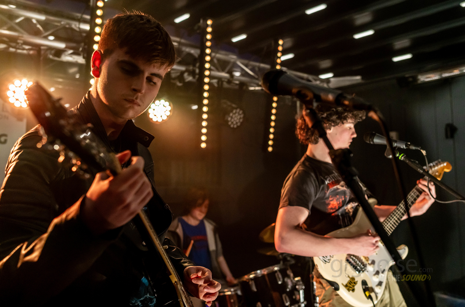 Guitarists performing live on stage at Battle of the Bands 2026